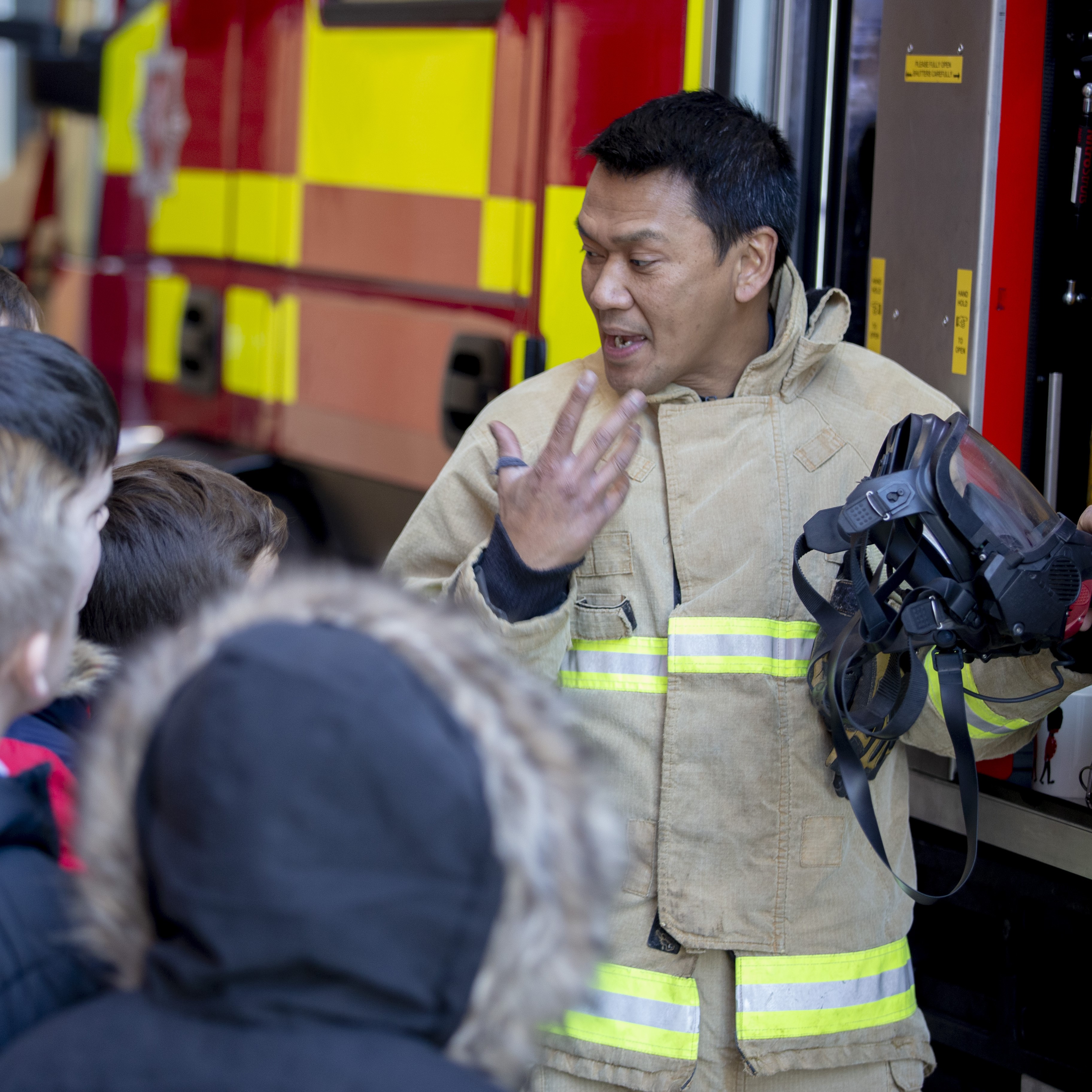 Firefighter talking to young people