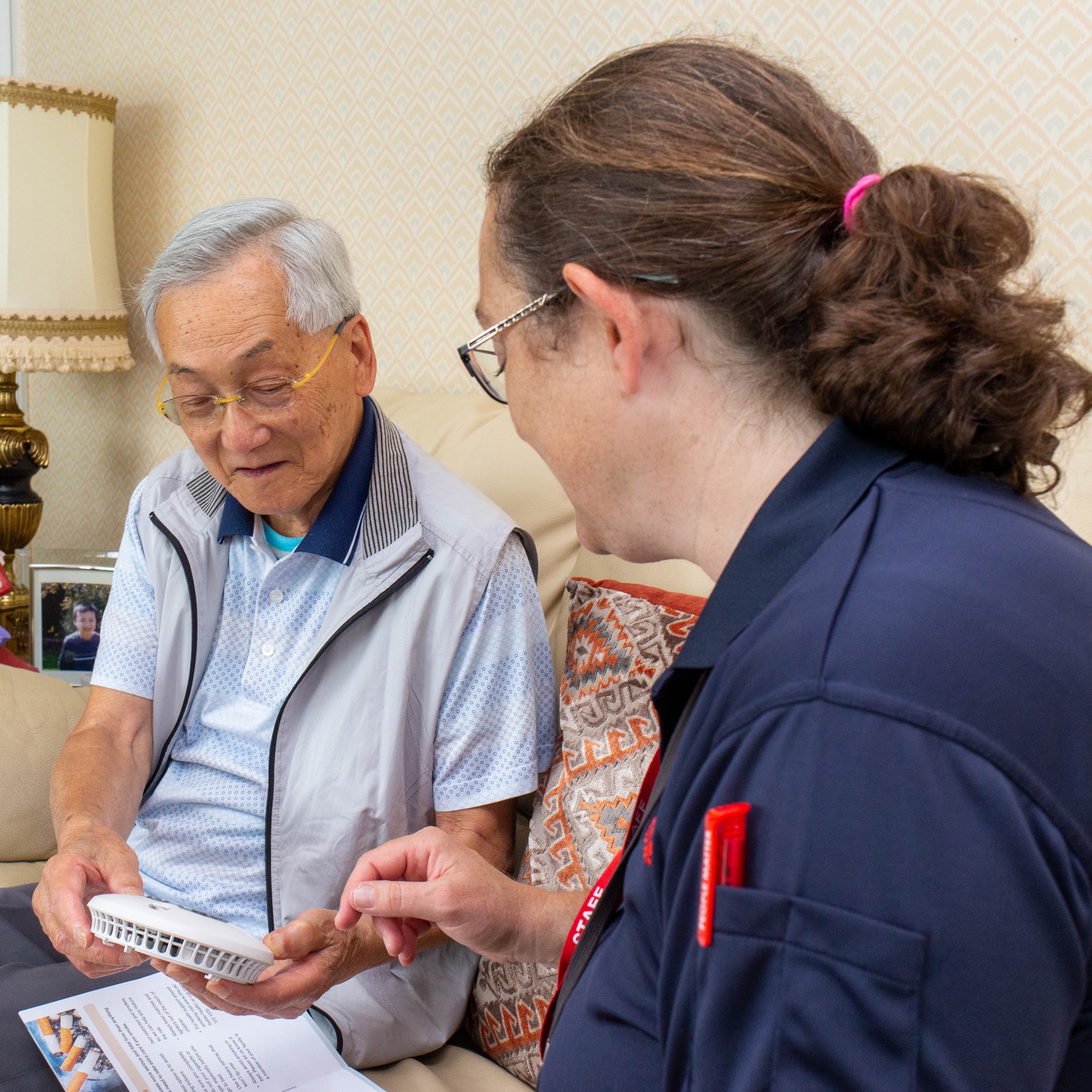 Staff member talking to individual