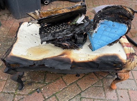 Destroyed remains of a laptop following a fire