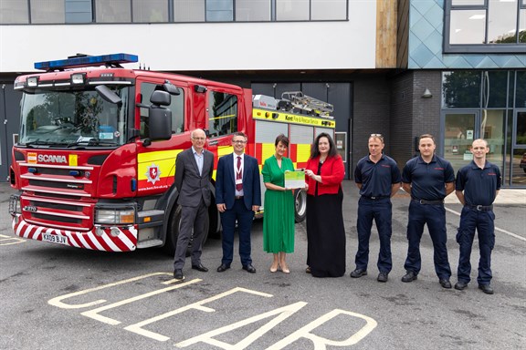 ICS presenting KFRS with a plaque to mark its ServiceMark achievement