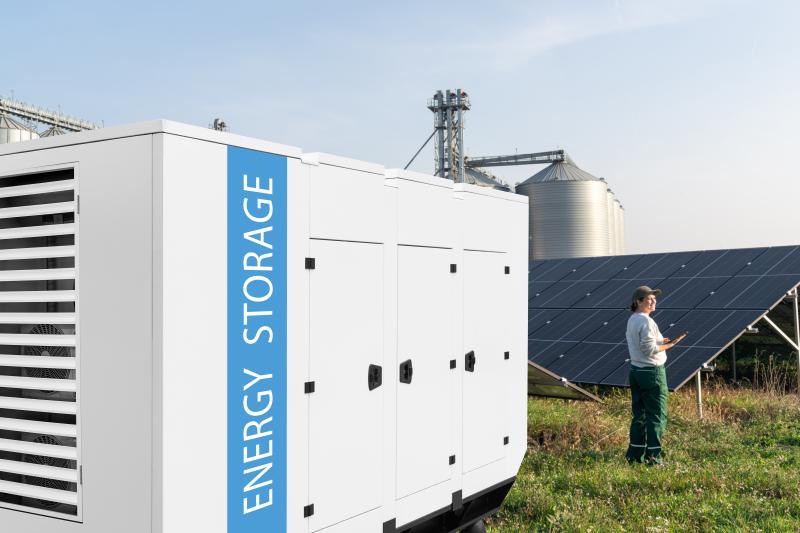 Battery unit with farm in distance