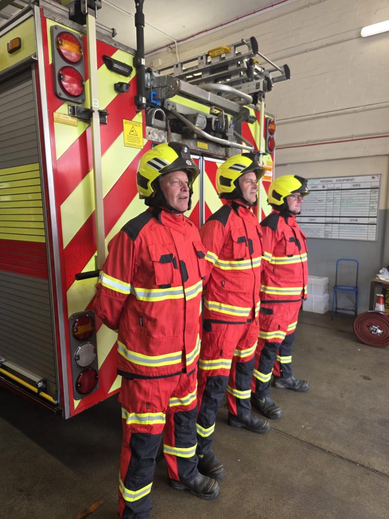 Three firefighters wearing the new lightweight PPE.