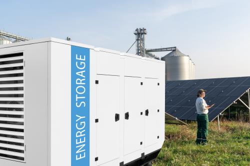 Battery unit with farm in distance