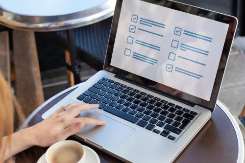 person on laptop completing a survey