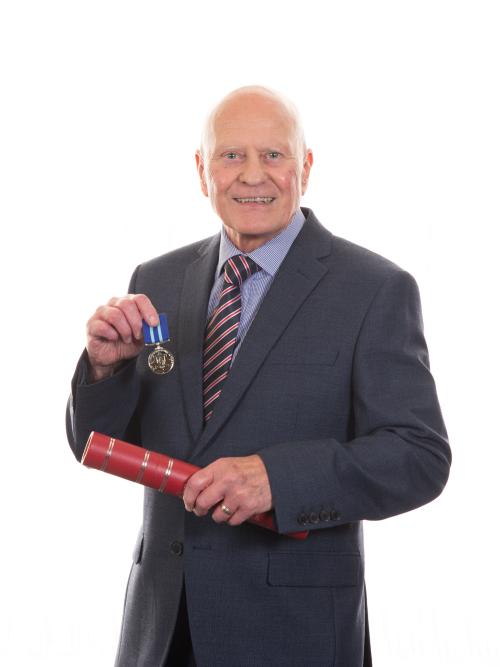 Dr Paul Grimwood presented with his MBE
