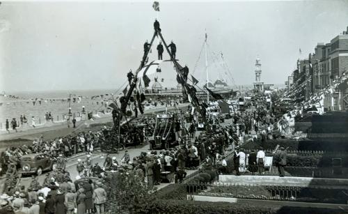 A picture of a Firemens Arch during the 1919 Peace Celebrations in herne Bay - where firefighters leaned their ladders to form an arch and climbed on them