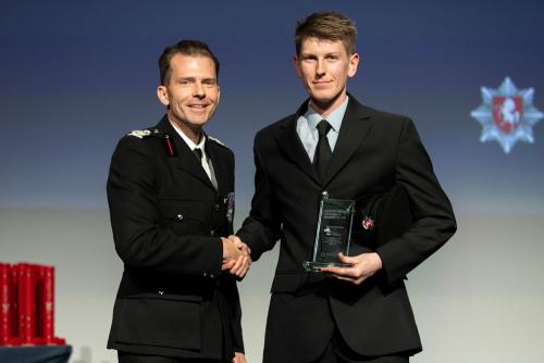 Firefighter Harry receiving an award