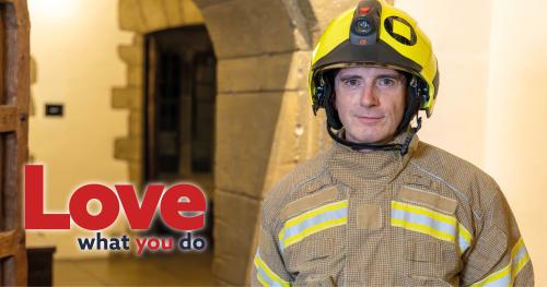 A firefighter, in PPE with a helmet, at a training exercise inside Leeds Castle