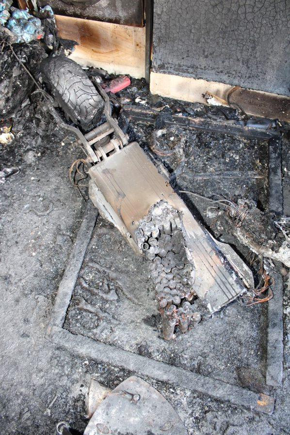 The remains of an e-scooter which caught fire at a flat in Sheppey