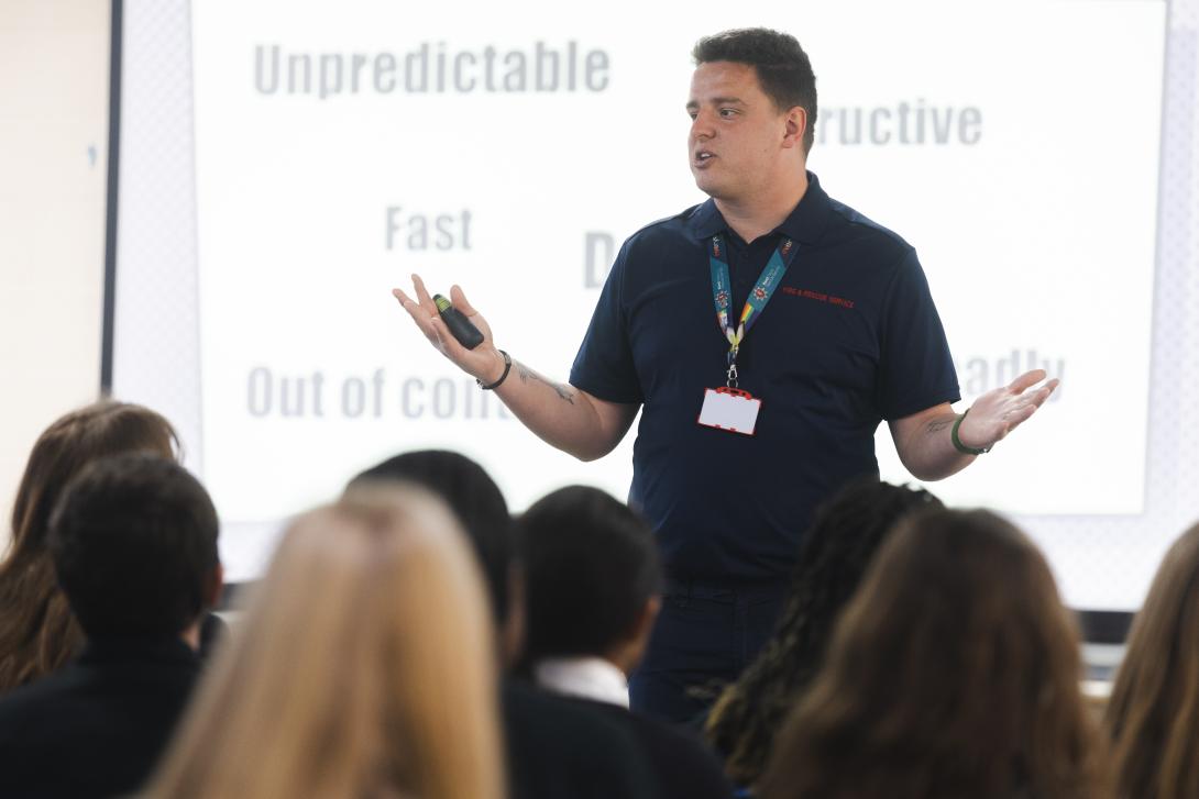 education officer teaching secondary school children about fire safety