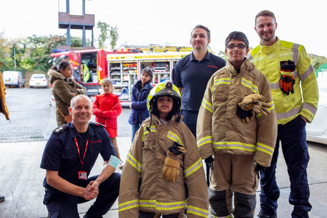 Customers from Hindu Swayamsevak Sangh UK with firefighters