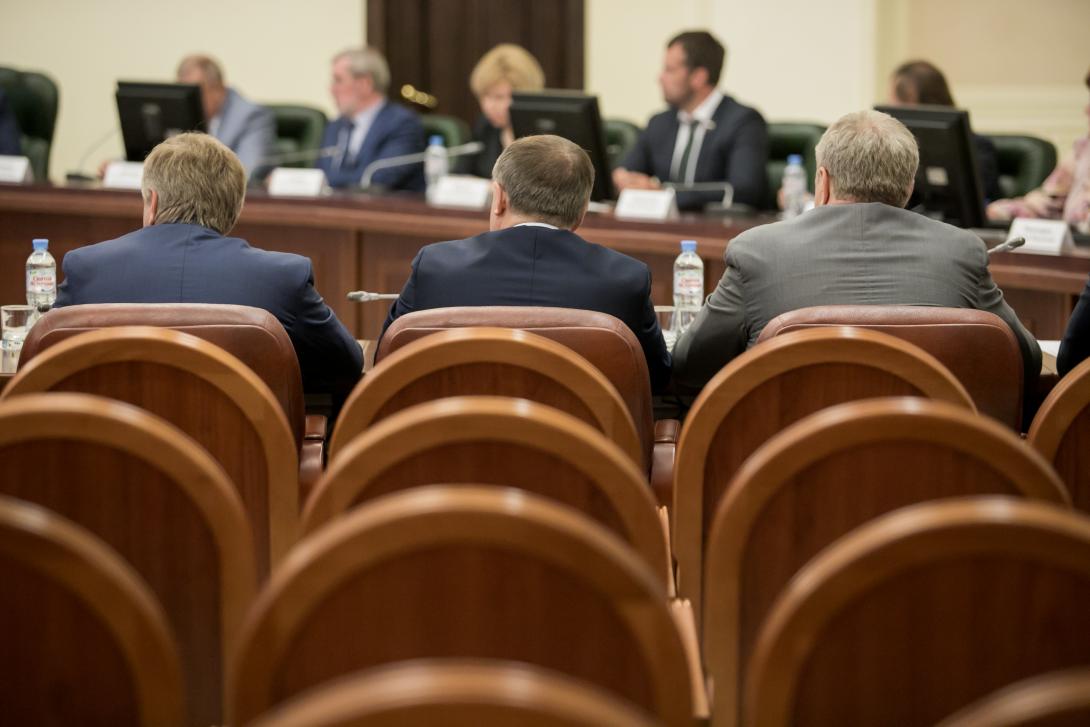 People in business formalwear having a meeting