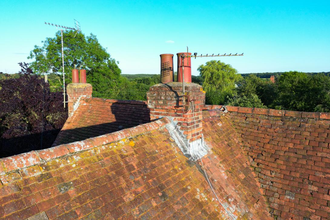 chimneys on roofs of rural homes