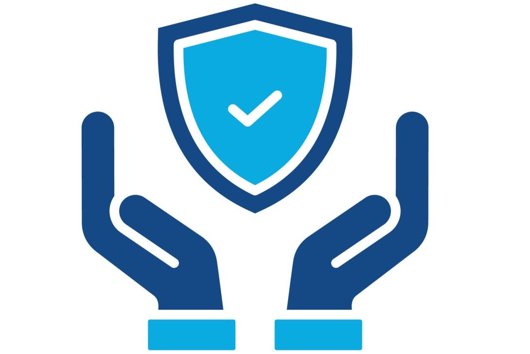 Hands holding shield containing a tick mark