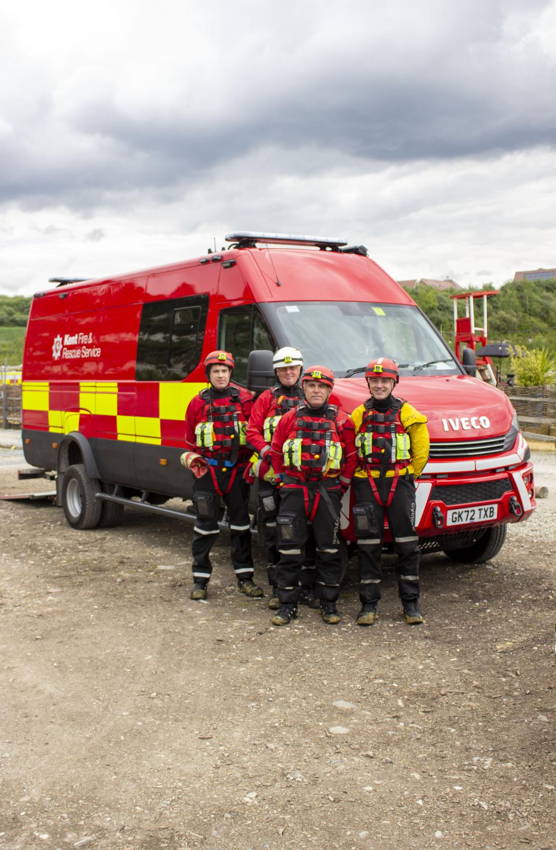 The new water rescue vehicle for Kent Fire and Rescue Service, with four firefighters stood in front of it