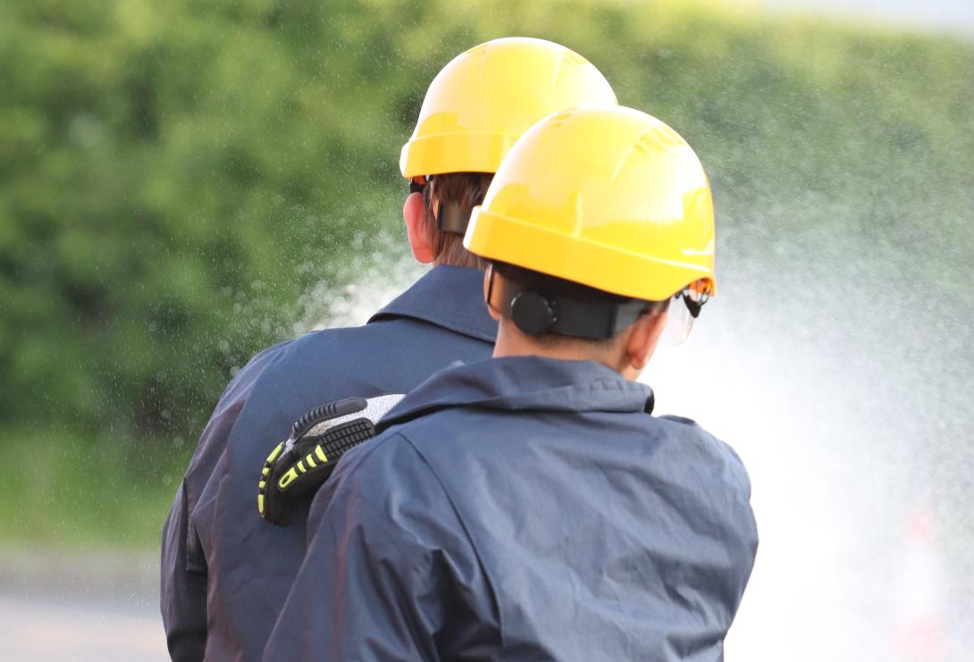 Fire cadets using a water hose